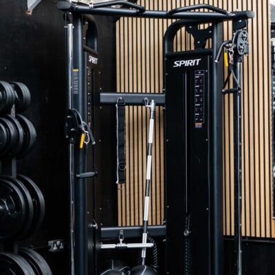 A corner of Foxes Gym showing the multi-functional gym station and weight plates