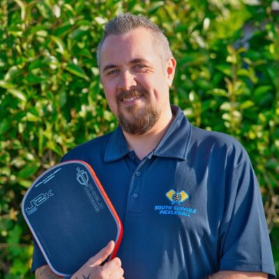 Jason Gordon, Pickleball England Level 1 coach at South Suffolk Pickleball, holding a paddle