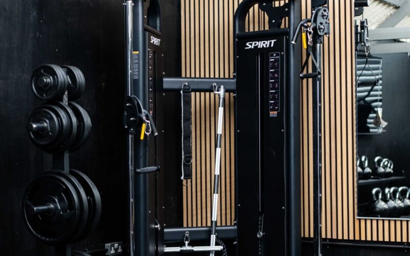 A corner of Foxes Gym showing the multi-functional gym station and weight plates