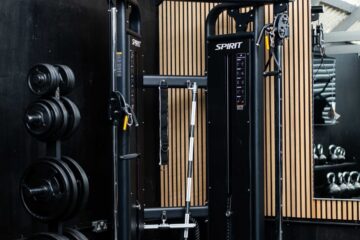 A corner of Foxes Gym showing the multi-functional gym station and weight plates